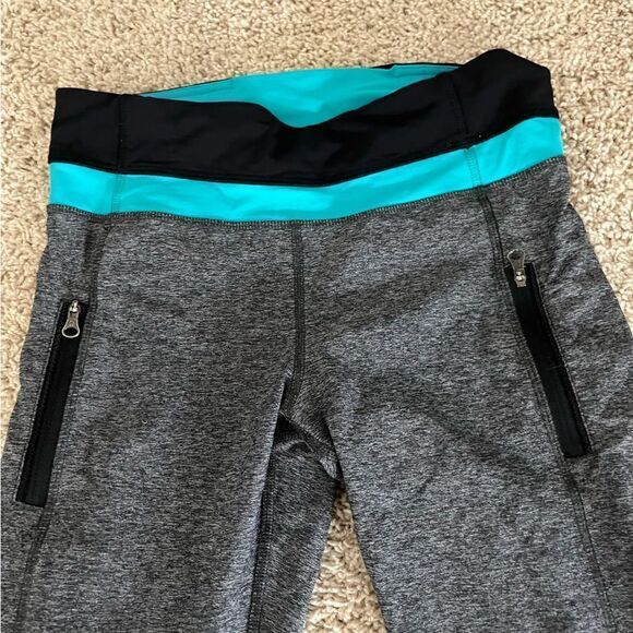 Lululemon Size 6 Gray Leggings with Mesh Cutouts and Teal at Waist - Picture 3 of 5